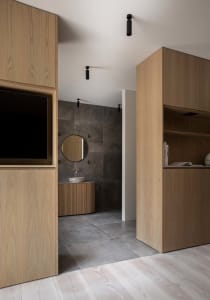 A modern bathroom featuring a concrete sink and walls.