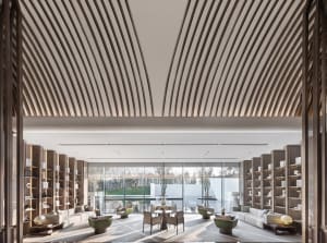 A contemporary minimalist hotel lounge featuring modern furniture and a sleek design.