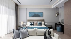A contemporary bedroom with a bed, nightstands, and decorative pillows.