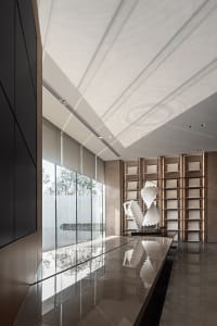 Modern office entryway with metal, glass, and concrete materials.
