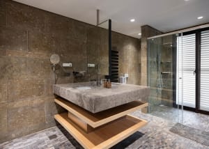 Modern bathroom with stone and concrete materials