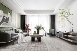 Modern lounge area featuring furniture with concrete, glass, and leather finishes.