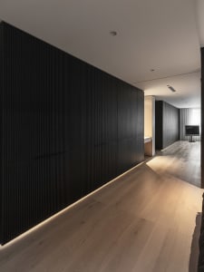 A modern minimalist interior designed with wooden elements.