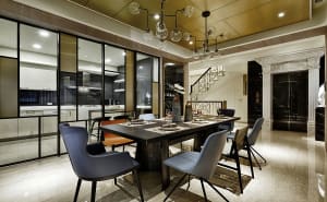 Modern dining room featuring metal, glass, and marble materials.