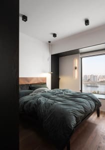 Modern bedroom design featuring industrial style elements with metal and wood finishes.