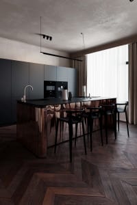 Modern kitchen with black metal cabinets and a central island.