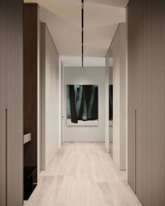 Modern corridor with white flooring and minimalist design.