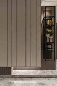 A modern minimalist storage unit with metal shelves and decorative items.