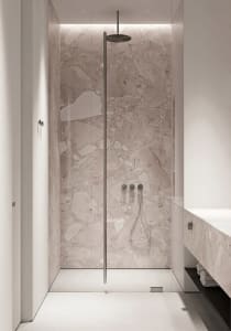 Modern minimalist bathroom with a luxurious marble shower stall.