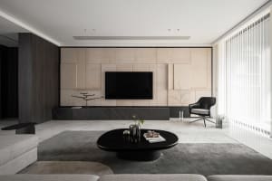 Modern living room featuring a minimalist design with marble and concrete materials.