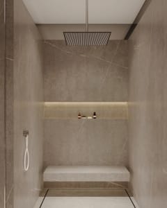 Modern, minimalist bathroom shower with marble walls and a built-in bench.