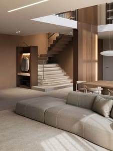 Contemporary living room with modern furnishings and a staircase in the background.