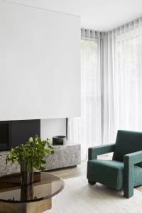 Modern living room featuring marble and glass elements