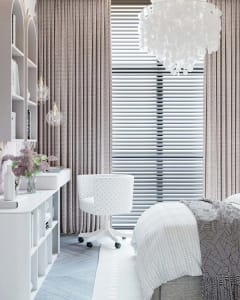 A photograph of a modern minimalist interior design featuring white fabrics.