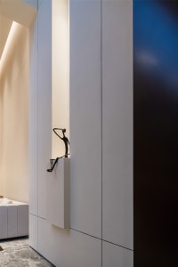 Concrete living room wall with minimalist sculpture