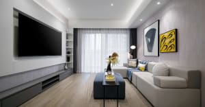 Modern living room with textured walls, minimalist furniture, and large window.