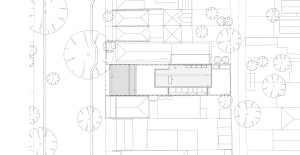 2D architectural drawing of a modern building layout on white paper