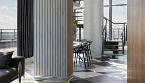 A modern interior design featuring a combination of wood, glass, and metal materials.