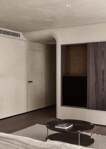 A modern minimalist living room featuring wood and concrete materials.