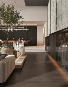 Modern living room with wooden floor and concrete accent wall.