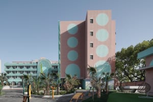 A modern building with concrete and glass exterior materials.