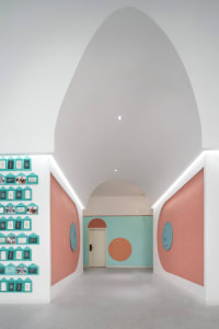 A minimalist corridor with vibrant colors and modern design elements.