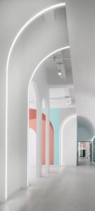 Modern minimalist interior design space with white walls and colorful accents.