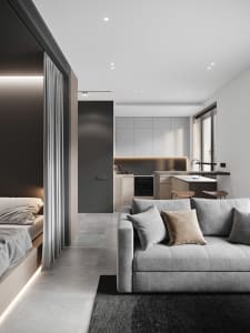 Modern minimalist living room and kitchen with concrete, wood, and leather materials.