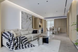 Modern living room featuring marble and wood elements