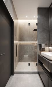 Modern minimalist bathroom featuring concrete walls and glass shower enclosure.