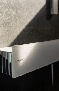 Translucent glass privacy screen in a minimalist bathroom setting.