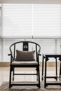 A modern black wooden console table with a minimalist design, featuring sleek lines and a simple, elegant aesthetic.