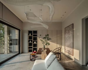 Minimalist living room featuring natural wood and marble materials.