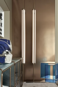 A minimalist living room featuring metallic accents and modern design elements.