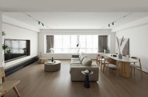 Modern minimalist living room with wood furniture and white walls