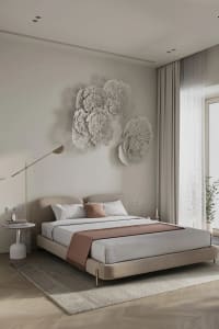 A minimalist bedroom featuring neutral fabrics and white walls.