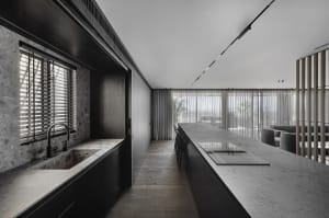 Modern kitchen with granite countertops and minimalist design