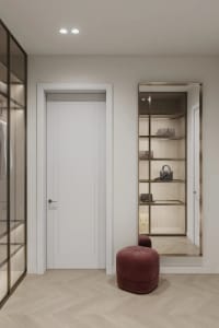 Modern, minimalist closet interior with white doors and glass shelves.