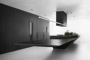 Modern kitchen featuring dark wood cabinets and a sleek, floating island.