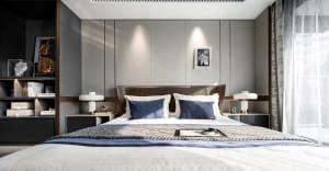 An elegant, minimalist bedroom with a white bed, grey paneling, and a mix of white and grey decorative elements.