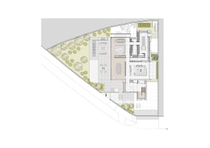 A modern living space with concrete tiles and floor plan diagram showing various rooms and layout.