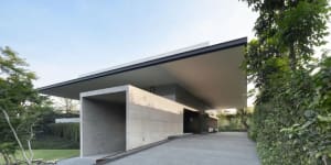 A modern residential home with a concrete exterior.