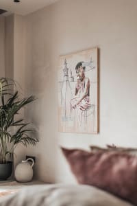 Minimalist interior design featuring an art drawing of a child eating ice cream.