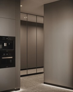 Modern metallic kitchen with sleek, minimalist design.