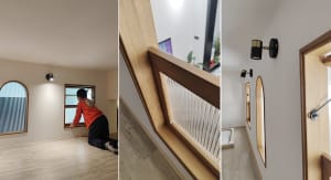 A child looking out of a window in a modern, glass-staircase interior design