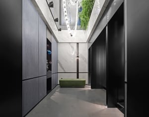 Modern interior corridor with concrete, marble, and wood materials