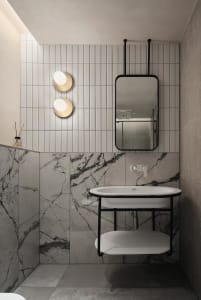 A modern bathroom with marble tiles and a floating vanity.