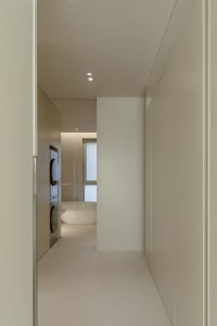 Modern minimalist bathroom featuring neutral colors and clean lines.