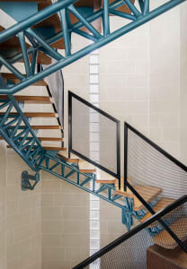 Metal staircase with a modern design, featuring industrial materials and an open layout.