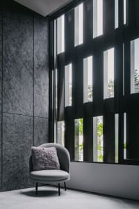A modern interior design featuring a glass window with light filtering through.